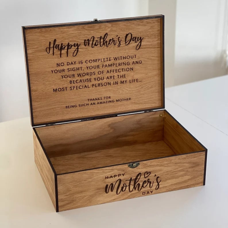 Wooden box with 'Happy Mother's Day' engraving on a white surface