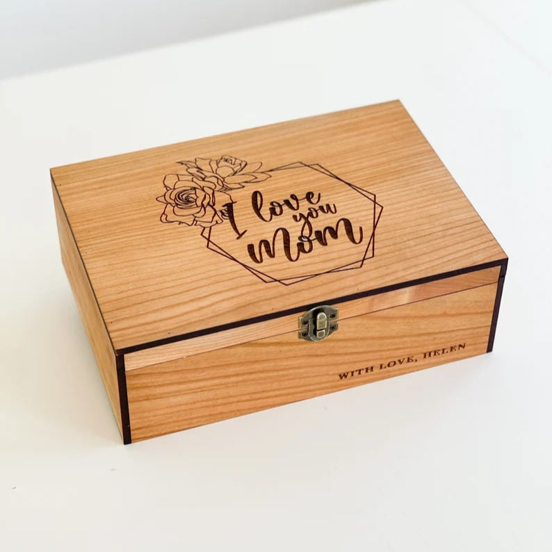 Wooden box with 'I love you Mom' engraving on a white background